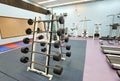 3 11 2021 closed and empty sport center with Modern light gym, equipment, Barbells of different weight on rack in university of