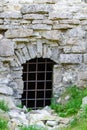 Closed entrance to ruins of medieval castle.