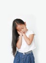 Closed eyes caucasian little child girl sleep gesture posing with hands togethe isolated over white background