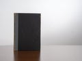 Closed fake black book - box, secret compartment. Old and worn, vintage item.