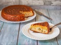 Closed fish pie on two plates, large and small portion