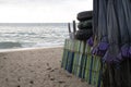 Closed folded parasol and a folded beach chair on the beach Royalty Free Stock Photo