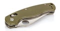 Closed folding pocket knife with textured dark green composite plastic cover plates on steel handle isolated on white background Royalty Free Stock Photo