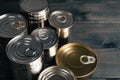 Closed food tin cans on dark background Royalty Free Stock Photo