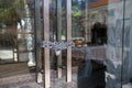 Closed glass door with mettalic chain