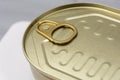 closed golden metal can close-up of a can with a key to open Royalty Free Stock Photo