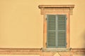 Closed Green Windows On Yellow Wall Of Old House In Florence Cit