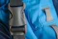 Closed grey fastex buckle of trekking backpack