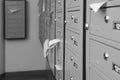 Closed grey metal mailboxes with receipts indoors, closeup. Space for text