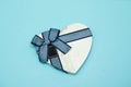 closed heart shaped box isolated on blue.