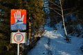 Closed hiking trail warning sign to STOP because of avalanches Royalty Free Stock Photo