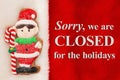 Closed for the holidays message with cute gingerbread elf