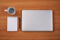 Closed Laptop Beside Empty Journal With Pen And Coffee Mug Over Table. Notebook Computer With Blank Notepad Ballpen