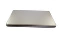Closed laptop on the white table Royalty Free Stock Photo