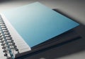 A closed light blue notebook with a spiral binding isolated on white background Royalty Free Stock Photo