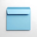A light blue paper envelope with a folded flap presented on a plain white background Royalty Free Stock Photo