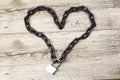The closed lock with keys shaped chain heart.
