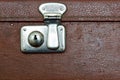 Closed lock of an old suitcase dark brown color Royalty Free Stock Photo