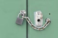Closed metal green door with Lock and chain Royalty Free Stock Photo