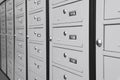 Closed metal mailboxes with keyholes and sequence numbers indoors