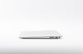 Closed modern, new laptop on white background, side view. Royalty Free Stock Photo