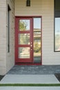 Closed modern red exterior door of a home