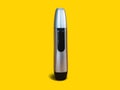 Closed Nose Trimmer isolated on yellow background. Front side standing position. Black and silver color