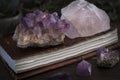 Closed Notebook or Journal with Amethyst and Rose Quartz Crystals on top Royalty Free Stock Photo