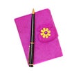 Closed notebook in a purple cover with a black ballpoint pen on Royalty Free Stock Photo