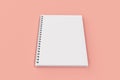 Closed notebook spiral bound on red background Royalty Free Stock Photo