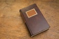 Closed Old Book on a Wooden Table Royalty Free Stock Photo