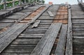 Closed old damage wooden bridge across canal