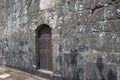 Closed Old metal, iron Door In A Wall. Doorway of a thirteenth century medieval castle Royalty Free Stock Photo