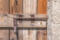 Closed old vintage wood door with rusty metal door lock Royalty Free Stock Photo