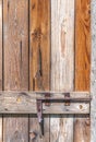 Closed old vintage wood door with rusty metal door lock Royalty Free Stock Photo