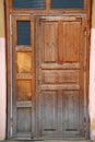 Closed old wooden dilapidated door