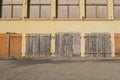 Closed old wooden doors, closed and abandoned building with rusty iron bar Royalty Free Stock Photo