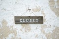 Closed at an old wooden sign