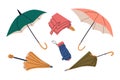 Closed, open, folded umbrellas in different colors