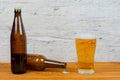 Closed and opened beer bottles with full glass Royalty Free Stock Photo