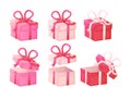 Closed and opened pink and red boxes set with red, white ribbon bows. Royalty Free Stock Photo