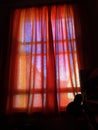 Closed orange bedroom curtains