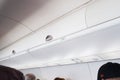 Airplane overhead compartment on a plane Royalty Free Stock Photo