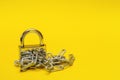 closed padlock with chain on yellow background with copy space, prohibition, taboo