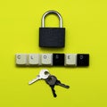 Closed padlock with keys on a yellow background at the bottom the inscription closed laid out from the keys of a computer keyboard Royalty Free Stock Photo