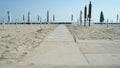 Closed parasols on the beach Royalty Free Stock Photo