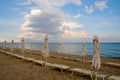 Closed parasols at the beach Royalty Free Stock Photo