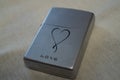 Closed petrol lighter in silver color, zippo