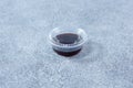 closed plastic condiment cup, soy sauce, container, lid