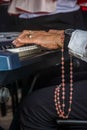 Closed portrait of a hand playing the piano in homage to corpus christ